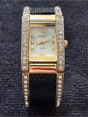 Embassy by Gruen" quartz cuff watch with crystal accents